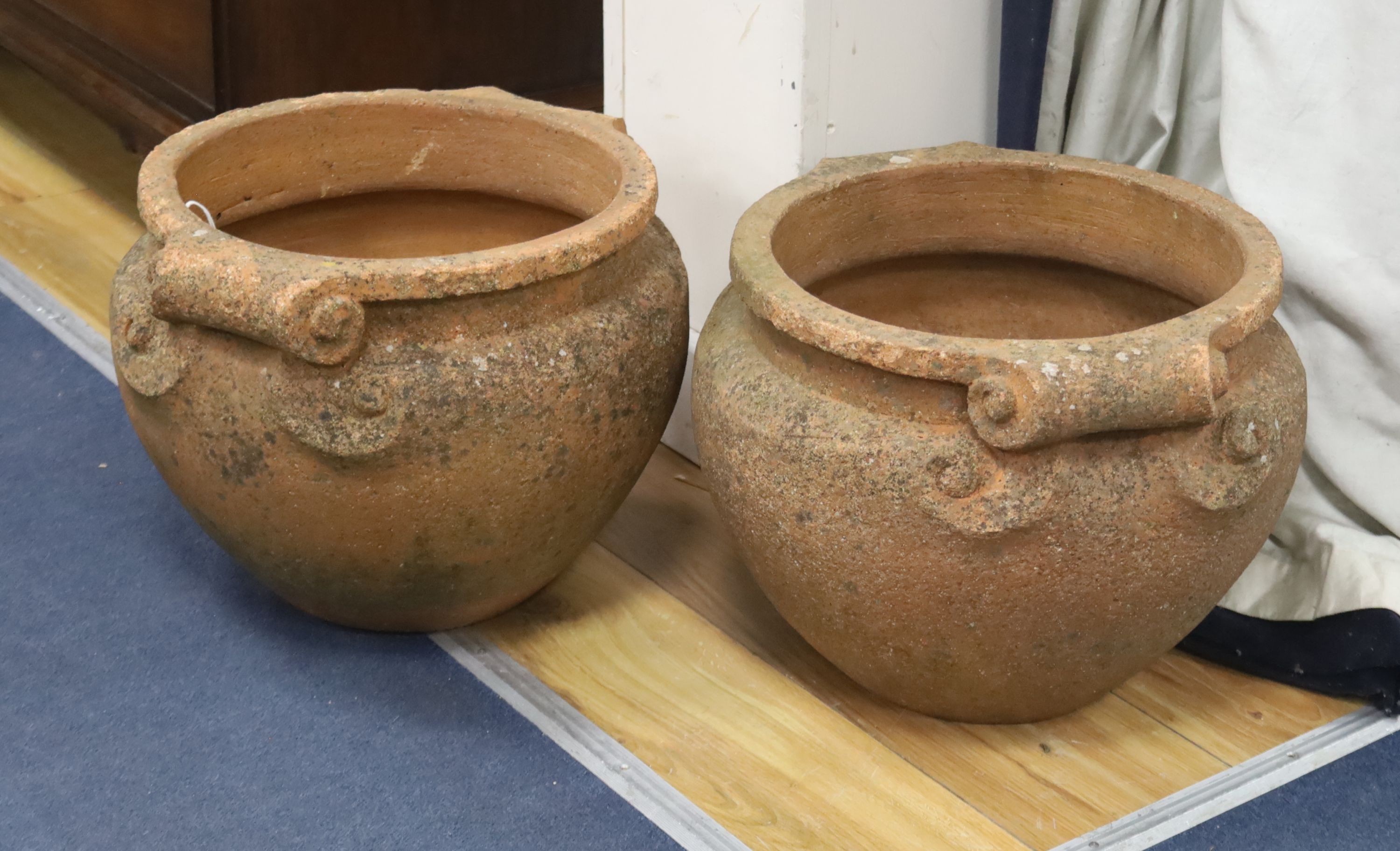 A pair of Compton terracotta garden urns, diameter 36cm, height 30cm